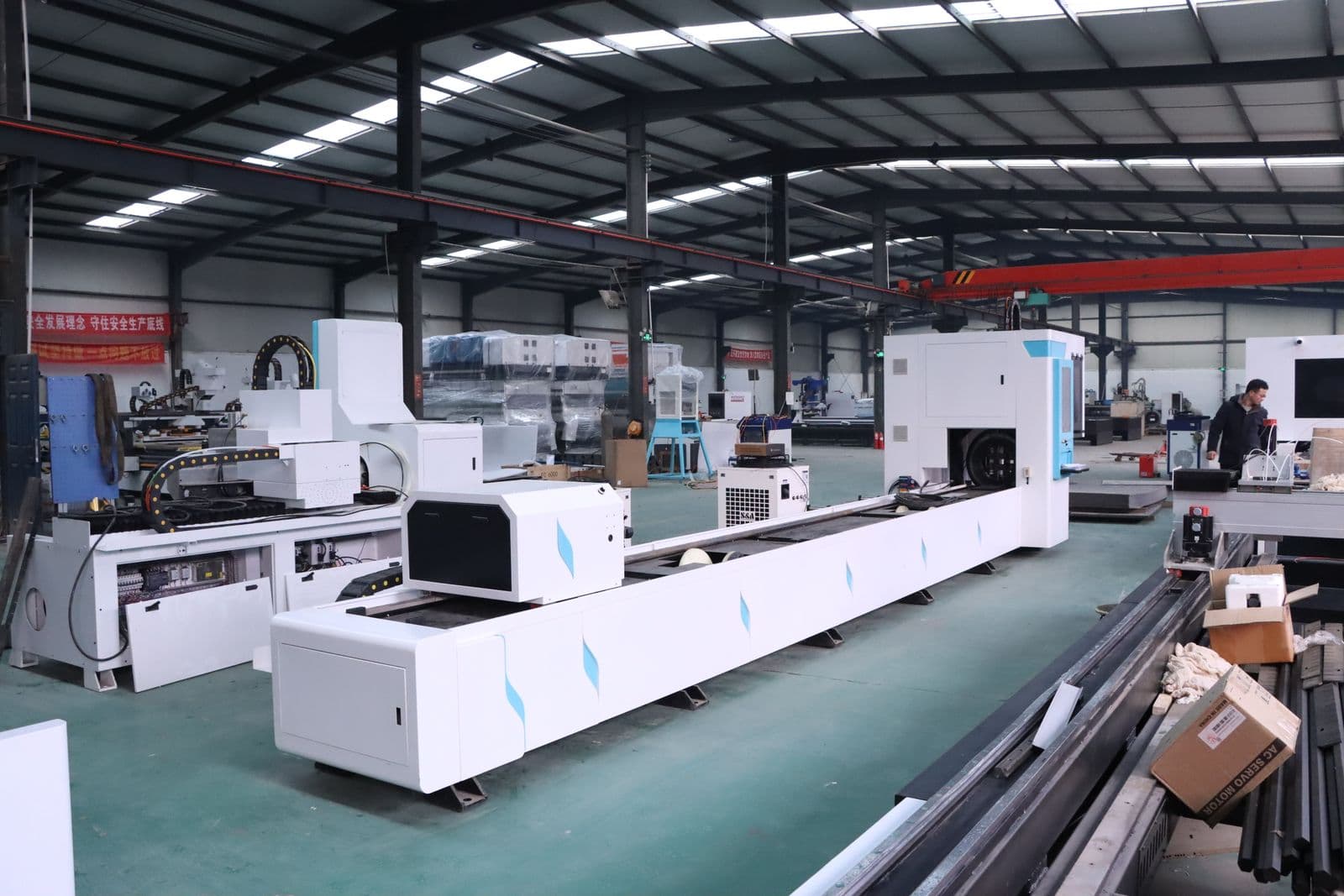 Row of CNC machining centres on an engineering works floor